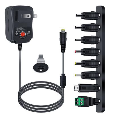 China UniversalÂ   12W Universal Adapter AC/DC Switching Power Supply with 8 Selectable Tips, for 3V to 12V Household Electronics for sale