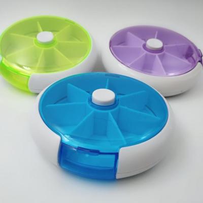 China Mini Small Medicine Round Colorful Plastic Medicine Box 7 Day Pill Box Medicine Box for sale