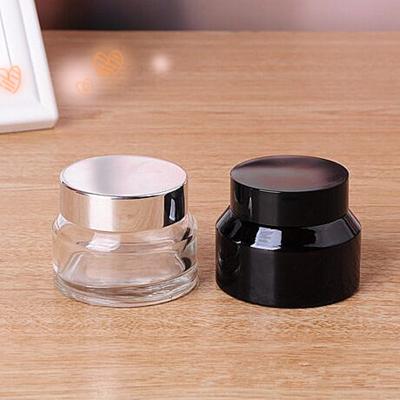 China Personal care 15 shoulder 30 50g glass jar cream sloping light amber cosmetic facial jar for sale