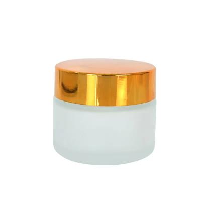 China Wholesale price 30ml cosmetic cream/face cream/hand cream/personal care cosmetic packaging 1oz frosted cream jar gold glass UV lid for sale