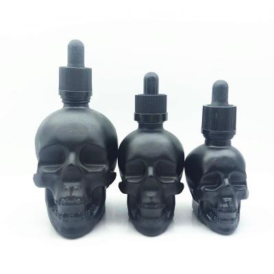 China Wholesale UV Proof 30ml 60ml 120ml Matte Black Skull Shape Glass Essential Oils Dye Oil Dropper Bottle Beard Oil Bottle for sale