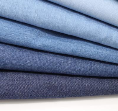 China Tela Woven Denim Fabric Manufacturers Breathable Stretch Denim Fabric High Quality Raw for sale