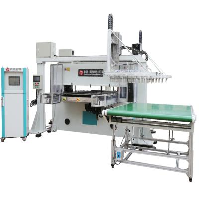 China Blister And PS Foam Products Plastic Packaging Disposable Box Press Die Cutting Machine With Mechanical Arm for sale