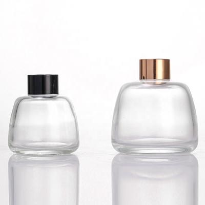 China Personal Care Aromatherapy 200ml Hot Bottle Round Shaped Glass Clear Diffuser Bottle With Cap for sale