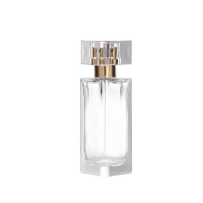 China 30ml Triangle Spray Glass Cosmetic High Quality Perfume Bottle With Acrylic Cap Cosmetic Packaging for sale