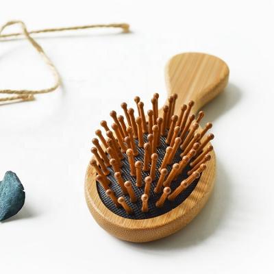 China Hot Selling Mini Size Waterproof Baby Bamboo Hair Brush Custom Logo Natural Paddle Scalp Massage for sale