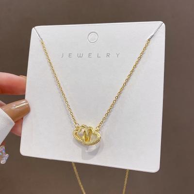 China Girlfriend Gift TRENDY Titanium Steel Gold Plated Hollow Double Heart Necklace Micro Paved CZ Cubic Zircon Heart Necklace For Lover for sale