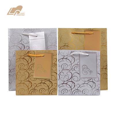 China Recycled Materials Custom Gift Paper Bag Hot Stamping Retail Packaging Bag for sale