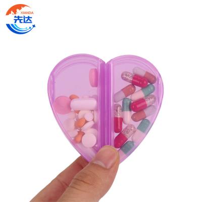 China Eco-friendly Weekly Heart Shaped Medicine Storage Box Oval Plastic Medicine Organizer Pill Trinket Box Compartmentable Box for sale