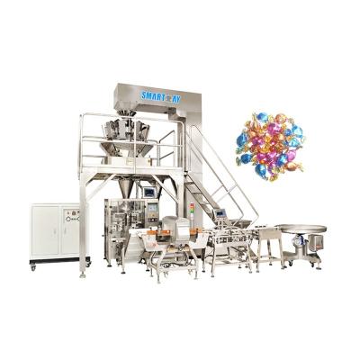 Cina VFFS Packaging Machine Small Dry Weigher Granule Biscuits Bag Packing Machine Smart Food Weigh Bag Packing Machine in vendita