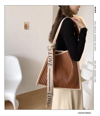 China Letter Ribbon Decoration Women Fashion Stripe Soft Vegan PU Leather Tote Handbag Wholesale Custom Luxury Designer Fold Wrinkles Shoulder Armpit Bag for sale