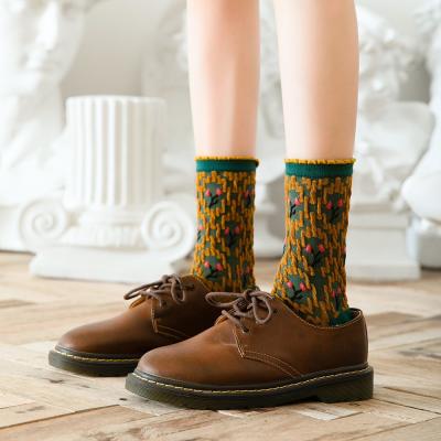 China Floral Jacquard Embossed Designer QUICK DRY Autumn Winter Combed Cotton Flower Color Socks For Women for sale