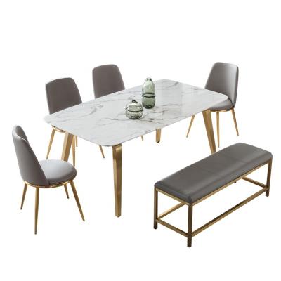 China (Others) Adjustable Modern Luxury Dining Room Furniture Agglomerated Stone Dining Table Customized Gold Stainless Steel Marble Dining Table Set for sale