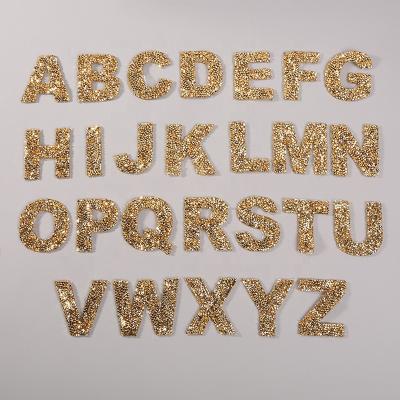 China hot sale 3D clothing accessory heat seal stick backing gold color rhinestone letters 5.5cm high alphabet DIY patches for makeup bag for sale