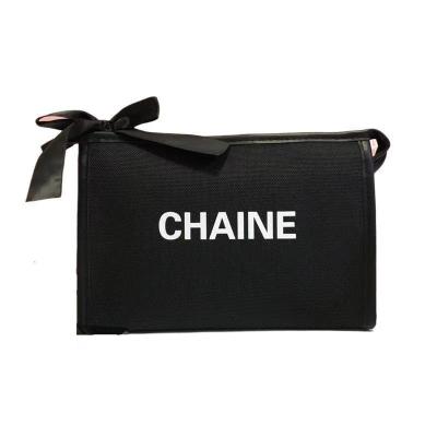 China 2022 New High Quality Women's Wholesale Polyester Small Perfume Solid Color Letter Cosmetic Portable Storage Bag In Stock for sale