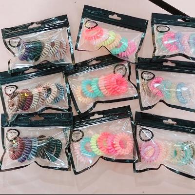 China XQ003 Hair Accessories Plastic Hair Ties Coils Colorful Rings Hair Rings In Plastic Box Telephone Wiring Headband For All Hair Type for sale