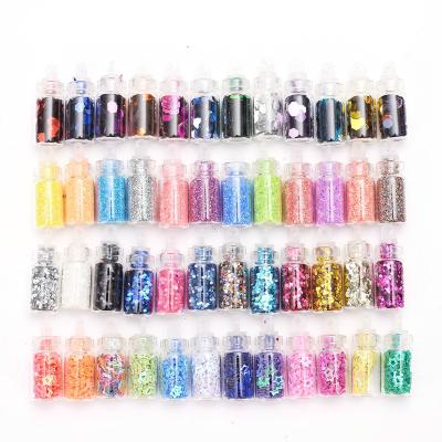 China BX495 48+ Designs Mixed Color Glitter Nail Art Decoration Various Styles Silicone Mold With Mini Glass Bottles For Nail DIY Crafts for sale