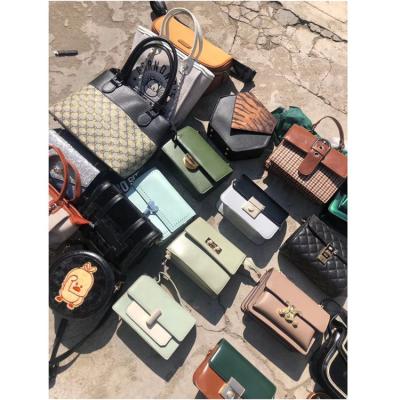 China Lady Stock Wholesale Mixed Fashion Design High Quality Women Used Handbags PU Leather Bag Bulk Sale Running Bullet for sale