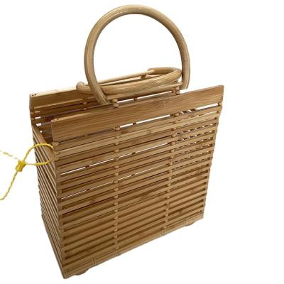 China Bamboo bag hot sale fashion square factory price round lid handle bamboo handbag for sale