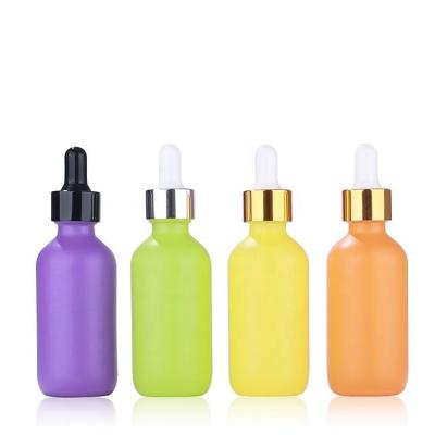 China 60ml Frosted Amber Colorful Boston Round Bottles Essential Oil Glass Dropper Bottle for sale