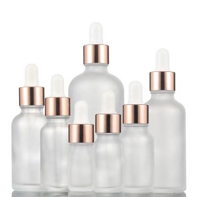 China Frosted Transparent Essential Oil Glass Bottles 5ml-100ml With Rose Gold Dropper for sale