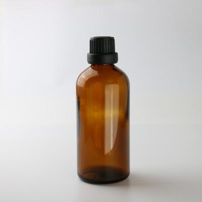 China Clear Amber Glass Essential Oil Bottles 50ml 100ml 200ml With Black Cap for sale