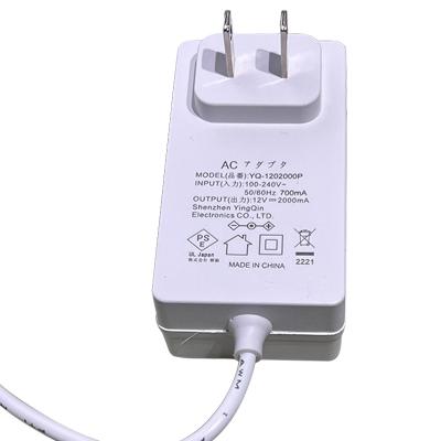 China Over Voltage DC to AC Adapter 12V Power Adapter 2A Japanese Standard European Standard Horizontal Cable Power Change Adapter for sale