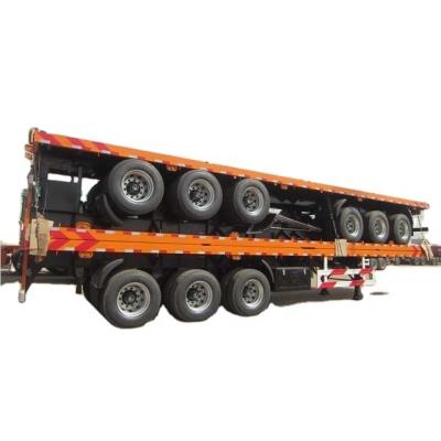 China Truck Trailer SINOTRUK Brand Flat Bed Semi Trailer With Hydraulic Ramp for sale