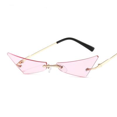 China Fashion Sunglasses Shape Beach Triangle Cat Eye Shaped Rimless Sunglasses Transparent Candy Color Eyewear Ocean Glass Party Lenses 8767 for sale