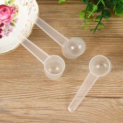 China 10g Disposable Perforated Plastic Round Bottom Measuring Cup Powder Spoon PP Plastic Free Shipping for sale