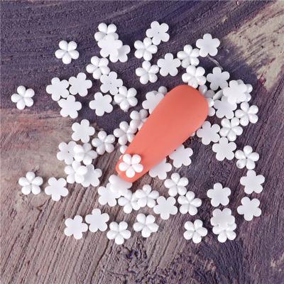 China Mini small white flower fashionable three-dimensional small jewelry resin minimum order white flower nail decoration for sale