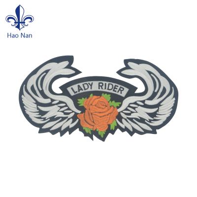 China 3D Wholesales Cheap Custom Fabric Embroidered Patch Backing With Adhesive for sale