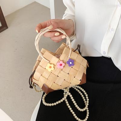 China 100% Eco-friendly 2021 New Women's Cross -Body Handmade Woven Bamboo Beach Straw Bag Summer Top-handle Tote Bags Pearl Chain Shell Handbag Travel for sale