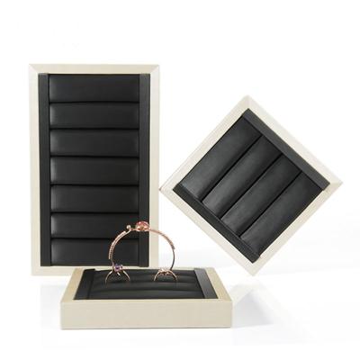 China MDF+PU Modern Design Popular MDF Ring Display Wrapped By PU Leather Wood Ring Display for sale