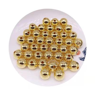 China DIY Perforated Gold Filled Beads ABS Polished Bright Round Beads Gold Plated Beads For Jewelry Making for sale