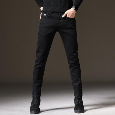 China QUICK DRY explosive black men's stretch solid color trend pants slim men's jeans trousers casual men's trousers for sale