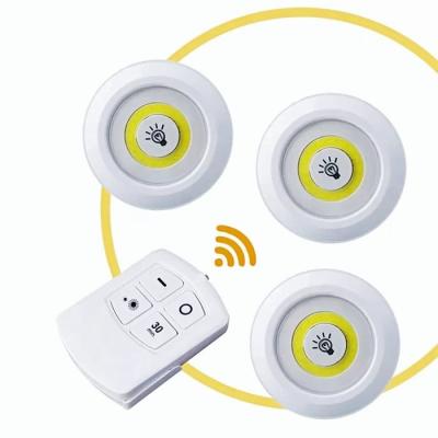 China Ultra Bright COB 150 Lumen Wall Mounted LED Puck Light With Remote Control Under Cabinet Light Tap Push Wireless Battery Operated Light for sale