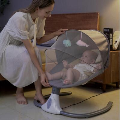 China Modern Remote Control Automatic Baby Swing Cradle With Mosquito Net for sale