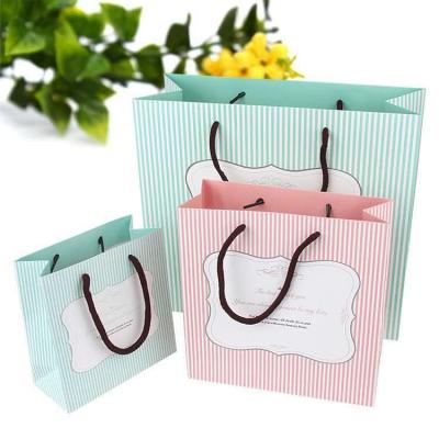 China Recyclable Printed Paper Bag Logo Printing Kraft Paper Bag Kraft Paper Bag For Shopping for sale