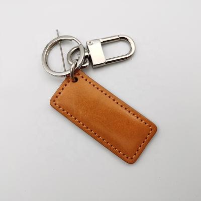 China Luxury Rectangle Top Grain Logo Luxury Rectangle Top Grain Vegetable Tanned Genuine Leather Vintage Leather Key Chain Custom Made Vegan for sale