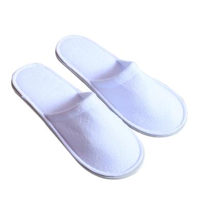 China China factory wholesale cheap unisex white custom logo hotel embroidered disposable disposable slipper for sale