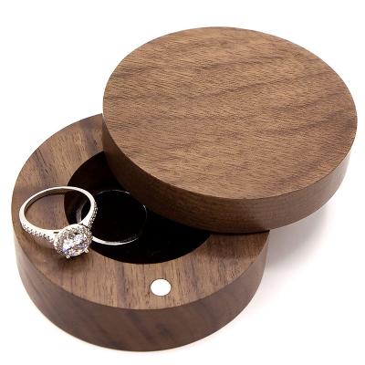 China Handmade Rotating Wooden Ring Box Jewelry Storage Gift Box Round Walnut Wedding Ring Bearer for sale