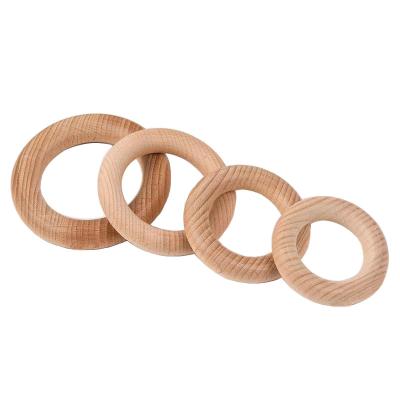 China Eco Friendly and Safe Wholesale Handmade Natural Circle Baby Wooden Teether Ring for sale