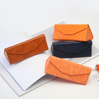 China Durable Foldable Handmade Leather Sunglasses Case Glass Folding Triangle PU Case for sale