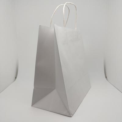 China Handmade Custom Printed Shopping Cutting Handle Kraft Paper Bag for sale