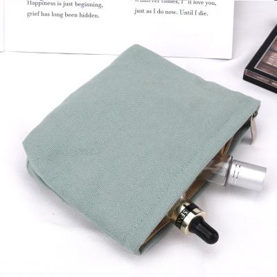 China Custom bottom blue portable cotton canvas makeup lake safety square travel cosmetic bag with metal zipper for sale