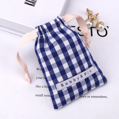 China Custom Logo Printed Plaid Fabric Cotton Safety Drawstring Gift Dust Bag Cosmetic Makeup Packaging Pouch for sale