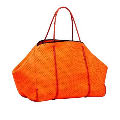 China Eco-friendly Perforated Ladies Handbags For Women Luxury Fashion Orange Neoprene Travel Handbags For Women Perforated Ladies Handbags for sale