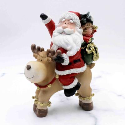 China Europe Polyresin Santa Claus With Presents Riding Reindeer Figurine Christmas Collection For Celebration for sale