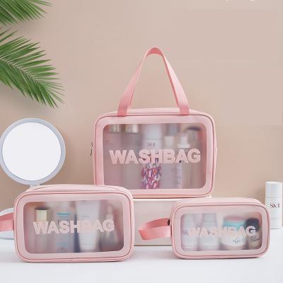 China Fashion Wholesale Clear Transparent Waterproof Logo Large Zipper TPU PVC Custom Makeup Bags Cosmetic Bag With Handle for sale